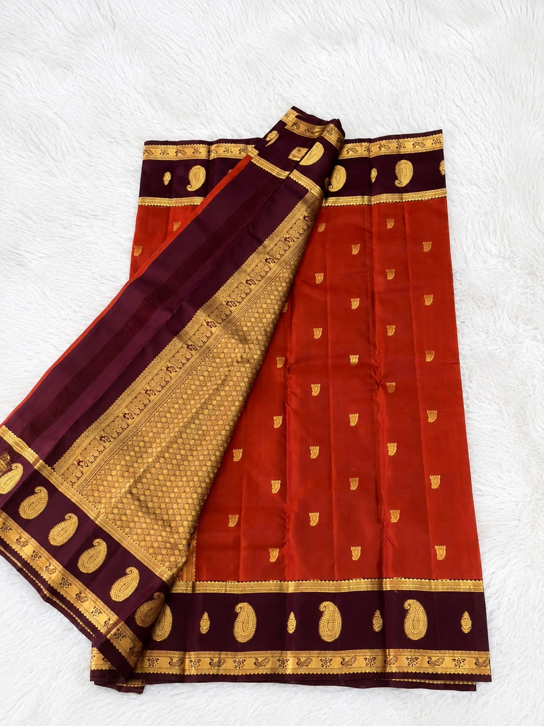 Rust Orange Silk Saree with Maroonish Brown Border & Gold Paisley Motifs
