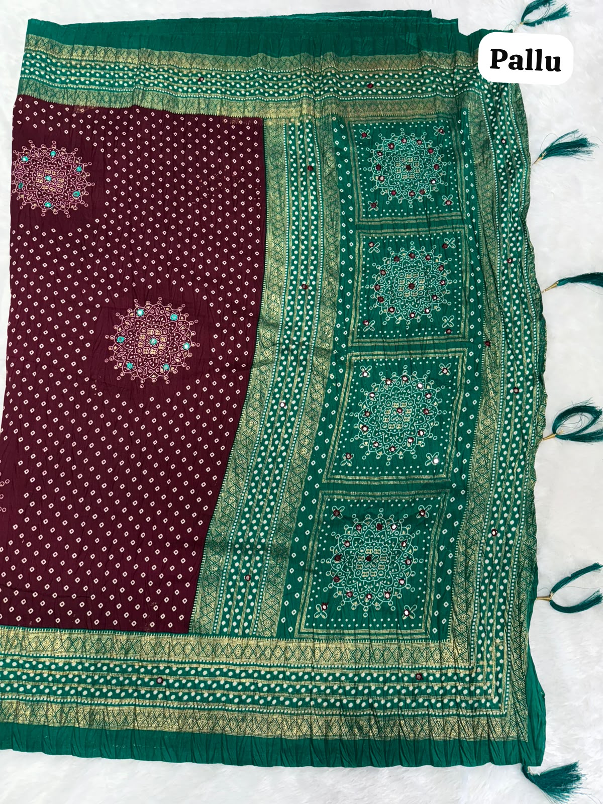 Crushed rich wine-maroon saree with a peacock green pallu Bandani Silk Saree with Mirror Work