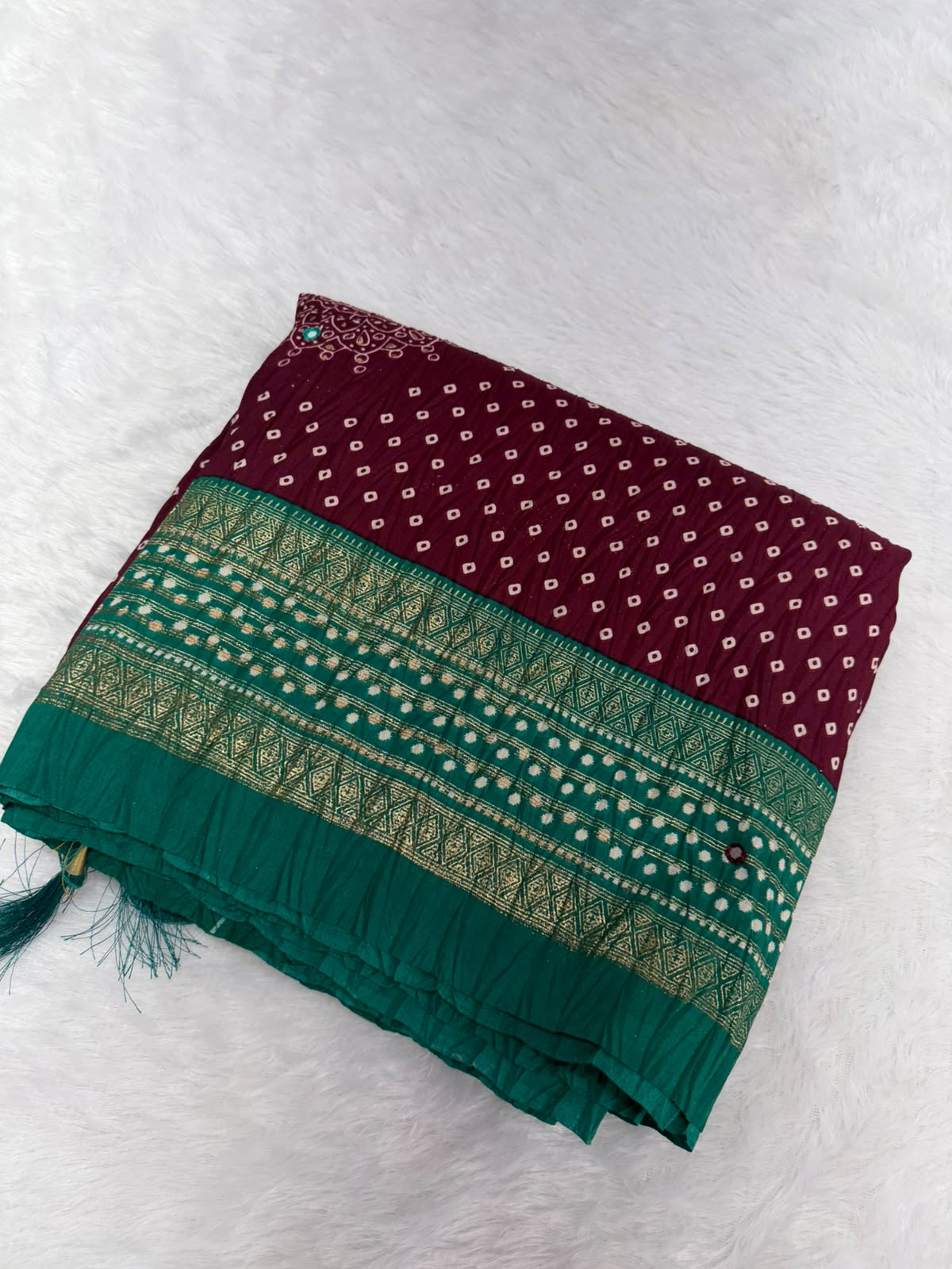 Crushed rich wine-maroon saree with a peacock green pallu Bandani Silk Saree with Mirror Work