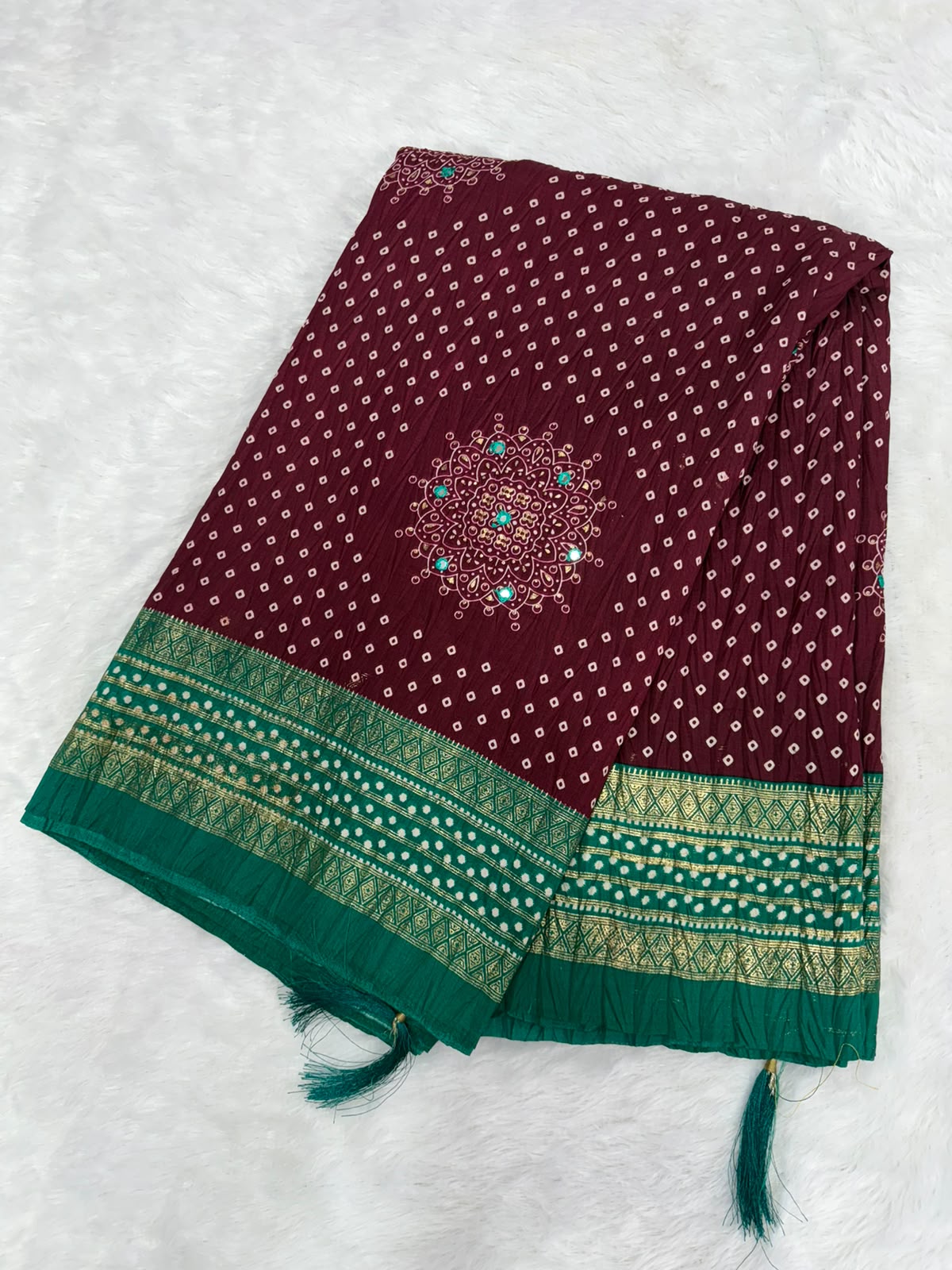 Crushed rich wine-maroon saree with a peacock green pallu Bandani Silk Saree with Mirror Work